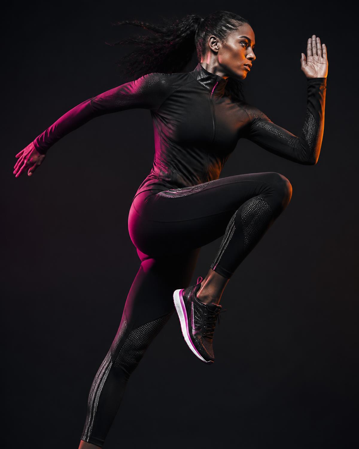 Athlete mid-stride in sculpted technical activewear